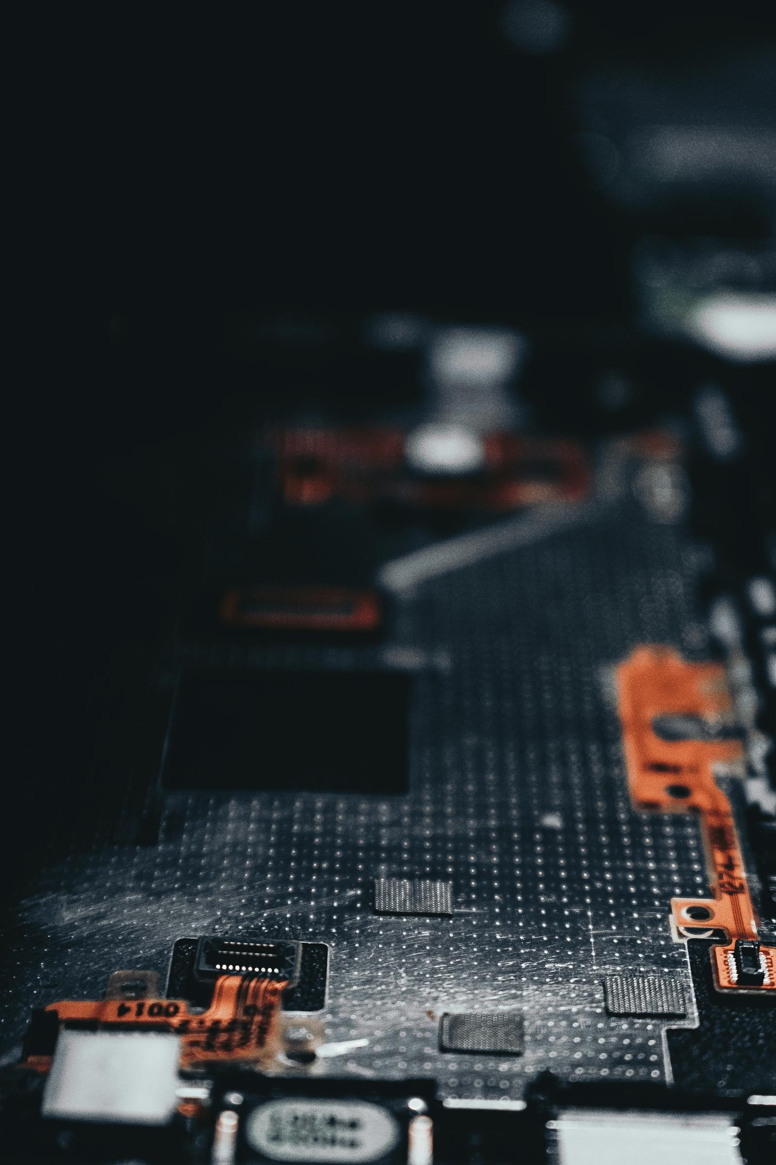 Close-up of a dark circuit board with copper traces